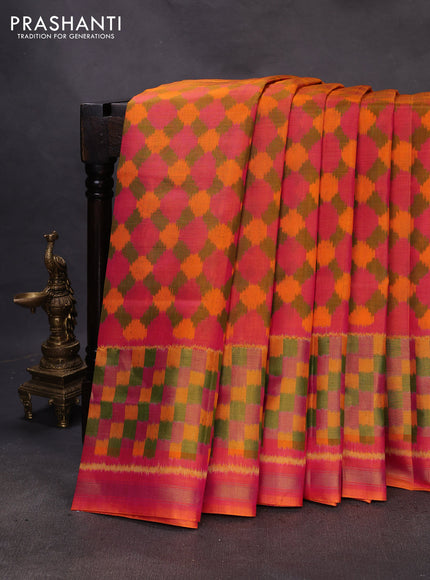 Rajkot patola silk saree dual shade of pinkish orange with allover ikat weaves and ikat woven zari border