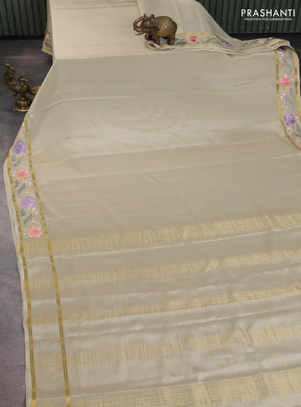 Pure mysore silk saree pastel green shade with plain body and floral embroidery cut work border