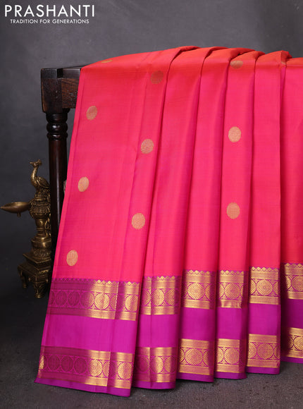Pure kanchipuram silk saree dual shade of pinkish orange and purple with zari woven buttas and rettapet zari woven border