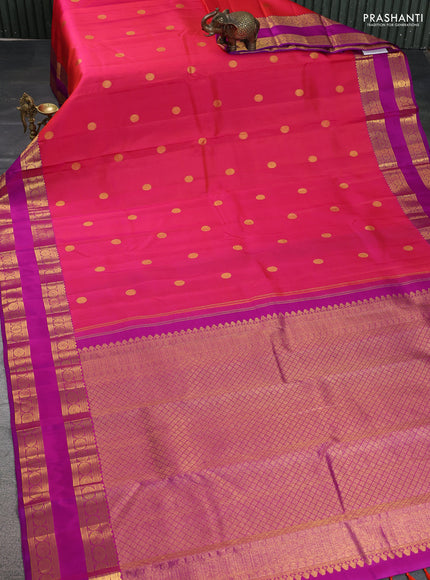 Pure kanchipuram silk saree dual shade of pinkish orange and purple with zari woven buttas and rettapet zari woven border