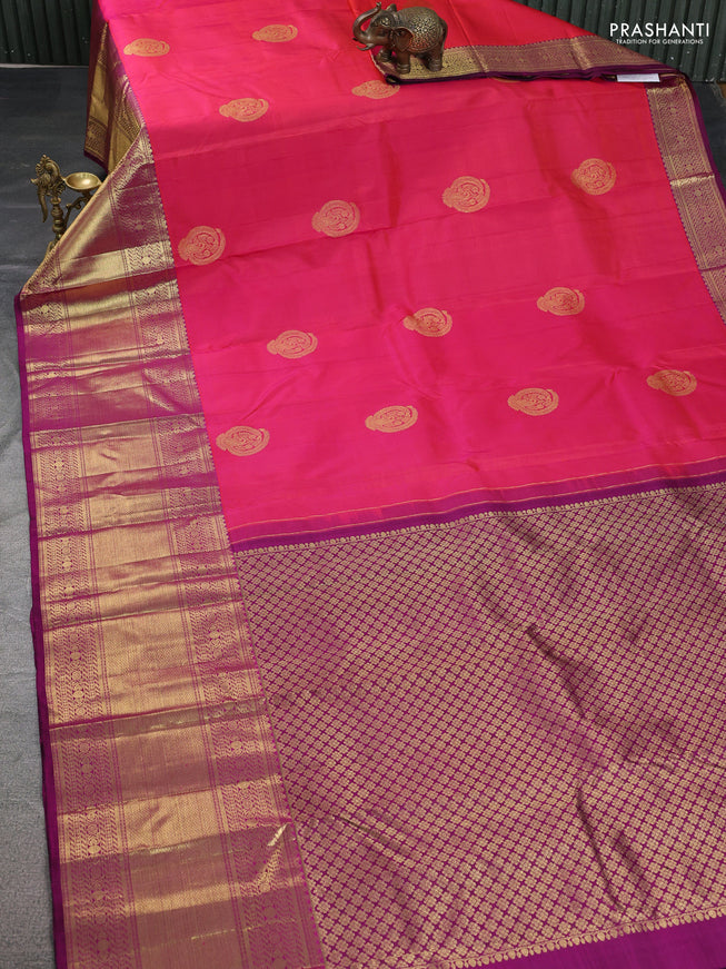 Pure kanchipuram silk saree dual shade of pinkish orange and purple with zari woven buttas and long zari woven border