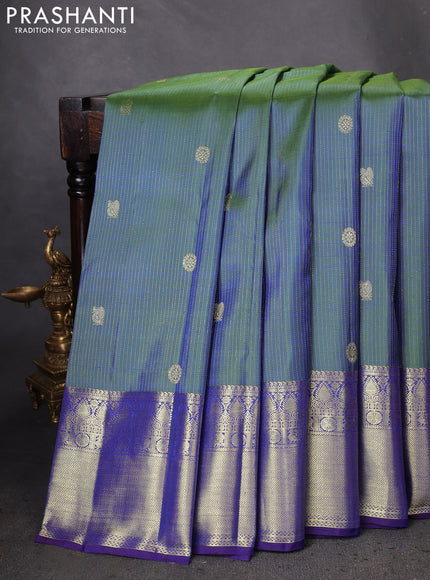 Pure kanchipuram silk saree dual shade of green and blue with allover zari weaves & buttas and zari woven border