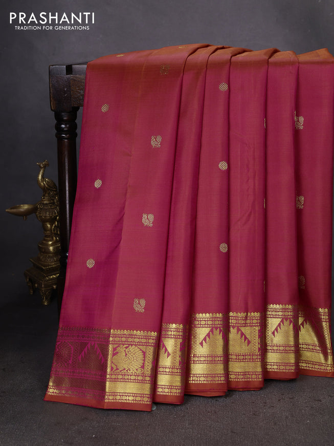 Pure kanchipuram silk saree dual shade of pinkish orange with zari woven buttas and zari woven border