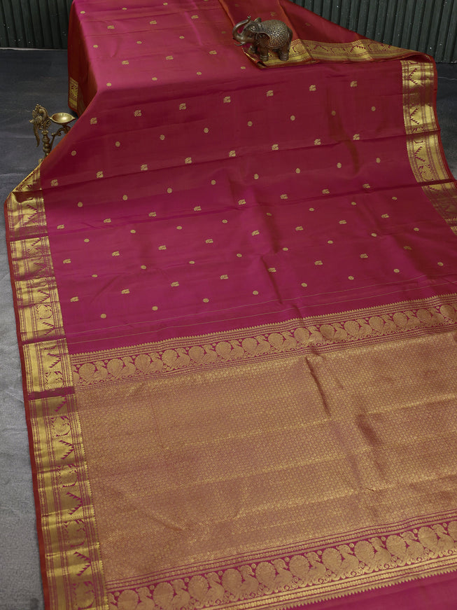Pure kanchipuram silk saree dual shade of pinkish orange with zari woven buttas and zari woven border