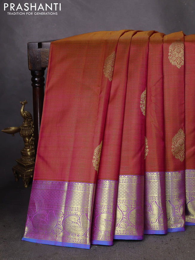 Pure kanchipuram silk saree dual shade of pinkish orange and dual shade of blue with allover zari woven stripes pattern & buttas and zari woven border