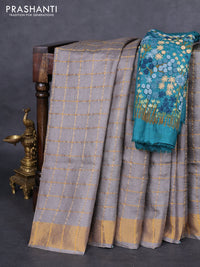 Pure tussar silk saree grey and teal green with allover zari checked pattern and zari woven border