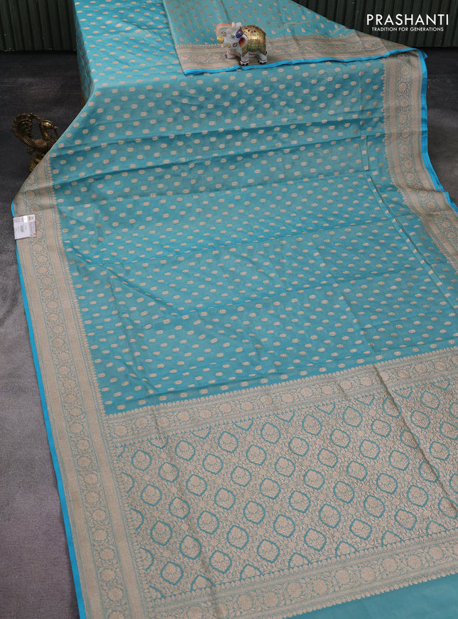 Banarasi tissue silk saree teal blue with allover zari woven buttas and zari woven border