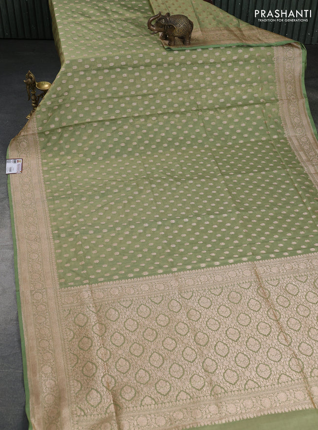 Banarasi tissue silk saree pista green with allover zari woven buttas and zari woven border