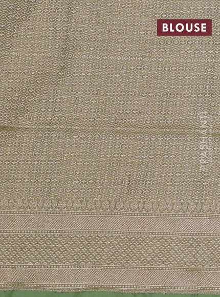 Banarasi tissue silk saree pista green with allover zari woven buttas and zari woven border