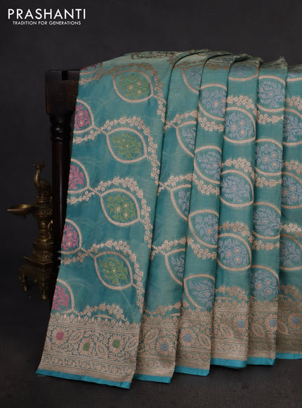 Banarasi tissue silk saree teal blue with allover zari woven brocade weaves and zari woven border
