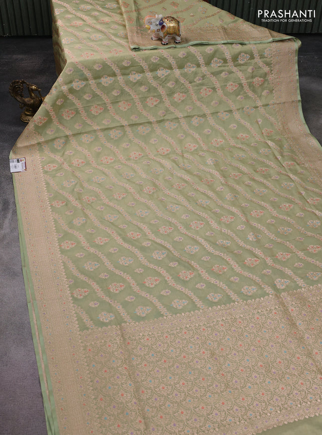 Banarasi tissue silk saree pista green with allover zari woven brocade weaves and zari woven border