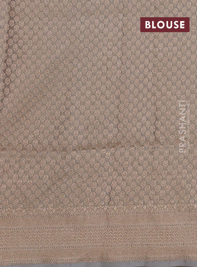 Banarasi tissue silk saree pastel grey with allover zari woven brocade weaves and zari woven border