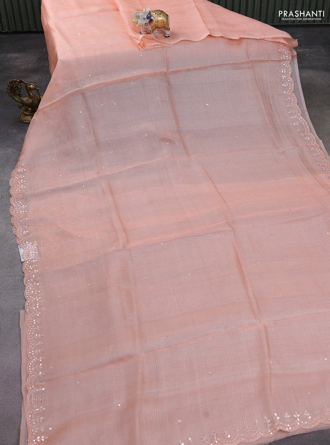 Pure silk kota saree peach shade with mirror embrodery buttas and mirror embriodery border