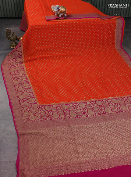 Banarasi georgette saree orange and pink with allover woven buttas and woven border