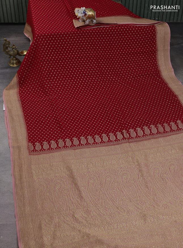Banarasi georgette saree red and peach shade with allover woven buttas and woven border