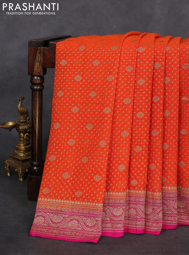 Banarasi georgette saree orange and pink with allover woven buttas and woven border