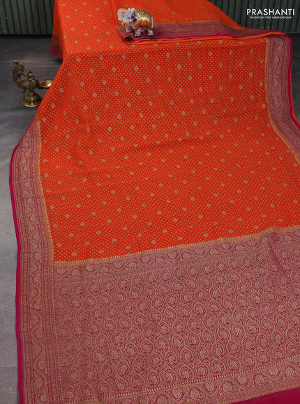 Banarasi georgette saree orange and pink with allover woven buttas and woven border