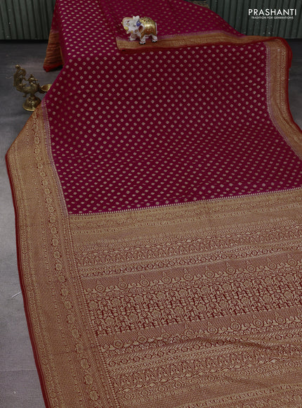 Banarasi georgette saree pink and orange with allover woven buttas and woven border