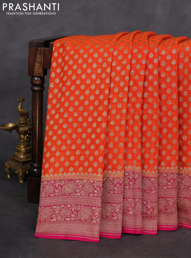 Banarasi georgette saree orange and pink with allover woven buttas and woven border