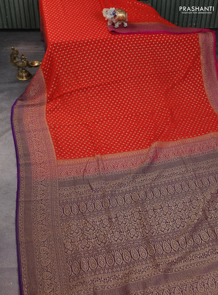 Banarasi georgette saree orange and pink violet with allover woven buttas and woven border