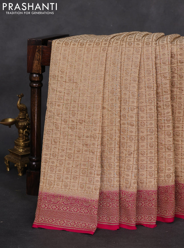 Banarasi georgette saree sandal and pink with allover checked pattern & buttas and woven border