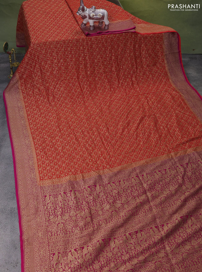 Banarasi georgette saree orange and pink with allover checked pattern & buttas and woven border