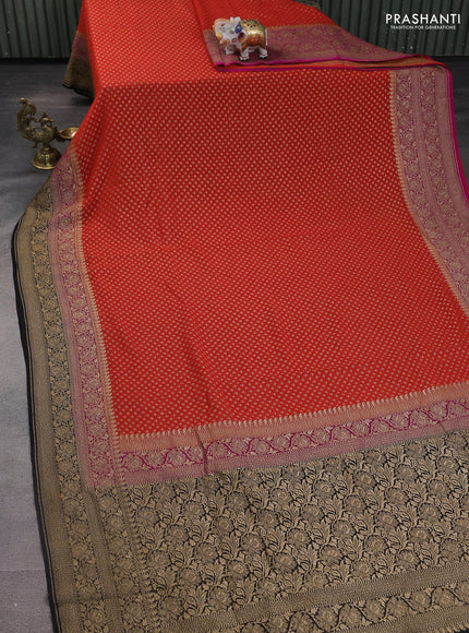 Banarasi georgette saree orange and pink black with allover woven buttas and woven border