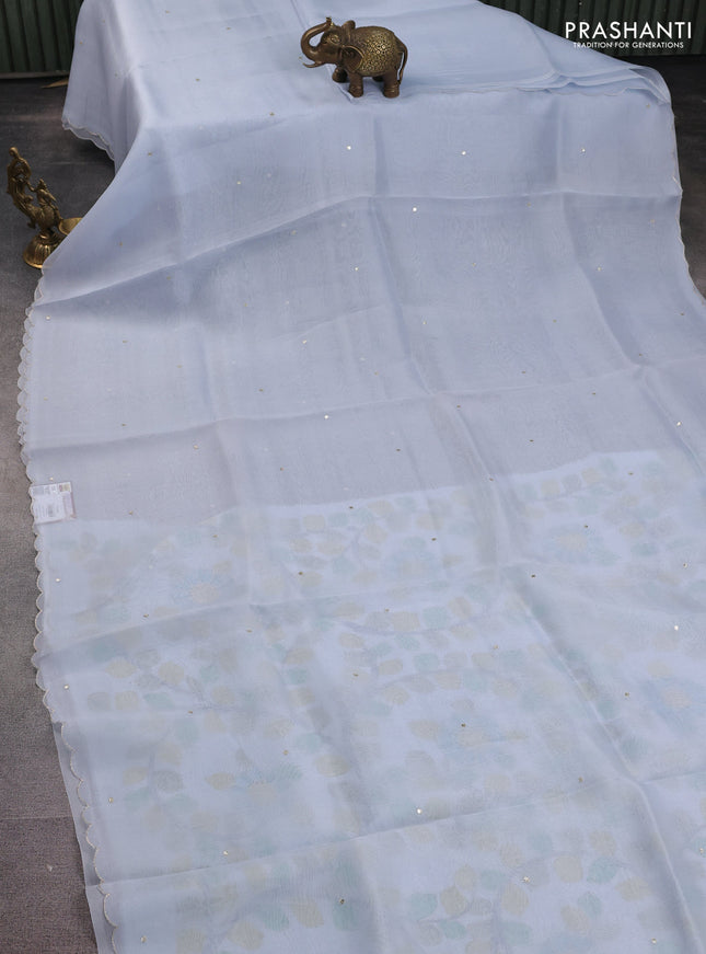 Pure organza silk saree pastel blue with sequin work buttas and embroidey scallop border Kalamkari prints pita work blouse