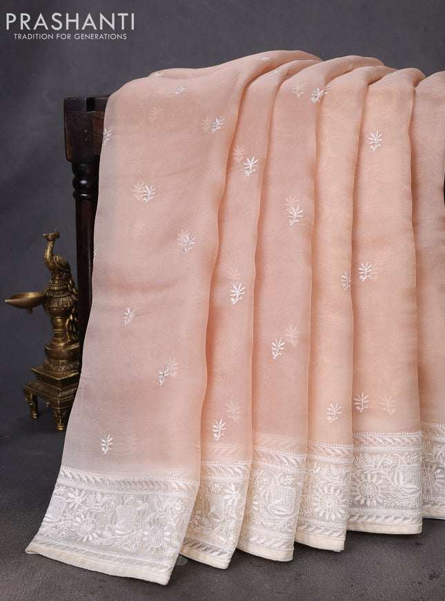 Pure organza silk saree sandal and cream with allover embroidery buttas and embroidery border