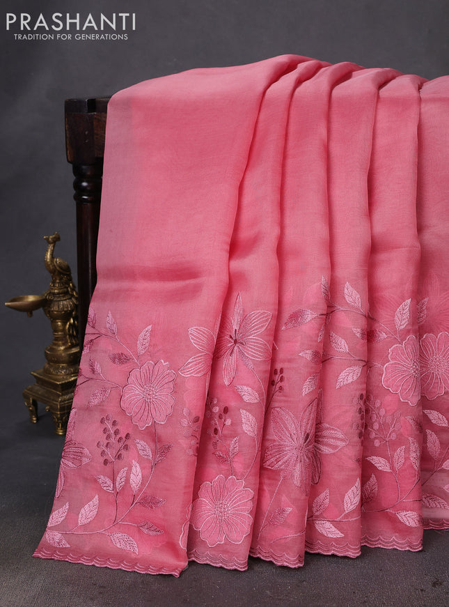 Pure organza silk saree peach pink with plain body and long floral embroidery border