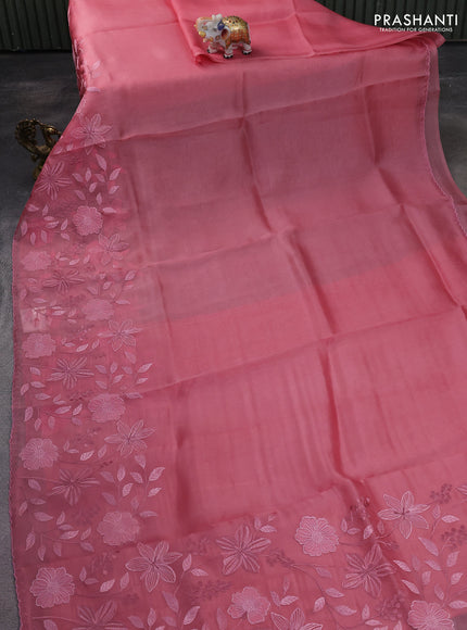 Pure organza silk saree peach pink with plain body and long floral embroidery border