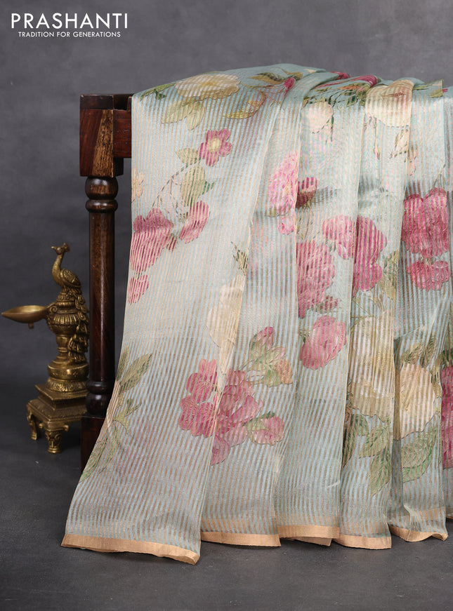 Pure organza silk saree pastel blue with floral digital prints & zari stripe pattern and zari woven piping border