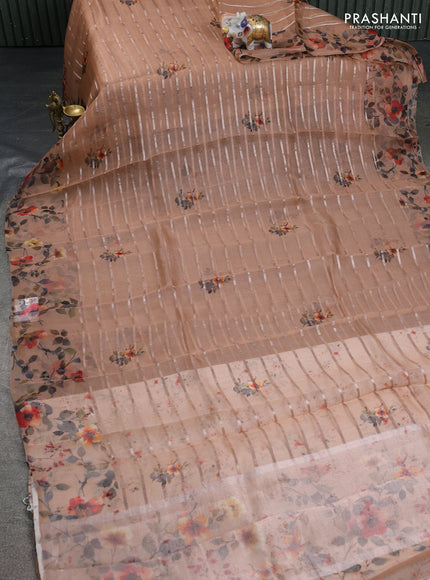 Pure organza silk saree rust shade with allover zari strip & floral digital prints and floral digital printed border