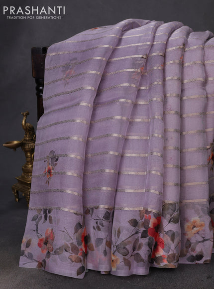Pure organza silk saree pastel lavender with allover zari strip & floral digital prints and floral digital printed border