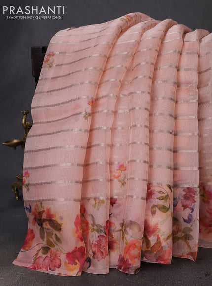 Pure organza silk saree peach orange with allover zari strip & floral digital prints and floral digital printed border