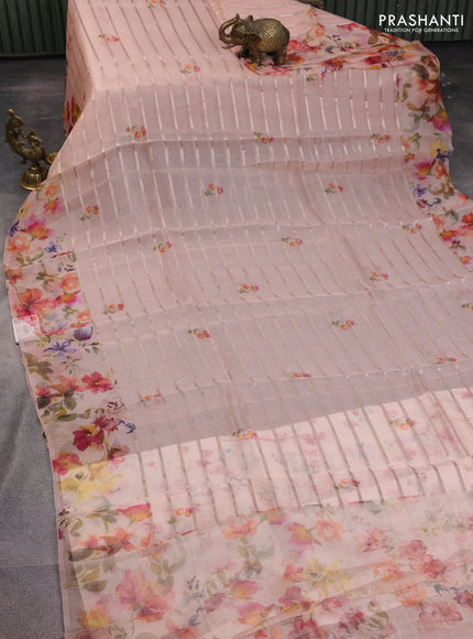 Pure organza silk saree peach orange with allover zari strip & floral digital prints and floral digital printed border