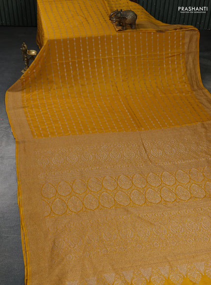 Banarasi crepe saree mustard yellow with allover geometric weaves and woven border