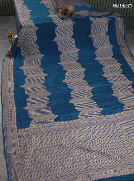 Banarasi crepe saree peacock blue with allover geometric weaves and woven border