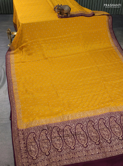 Banarasi crepe saree mustard yellow and wine shade with woven buttas and woven border