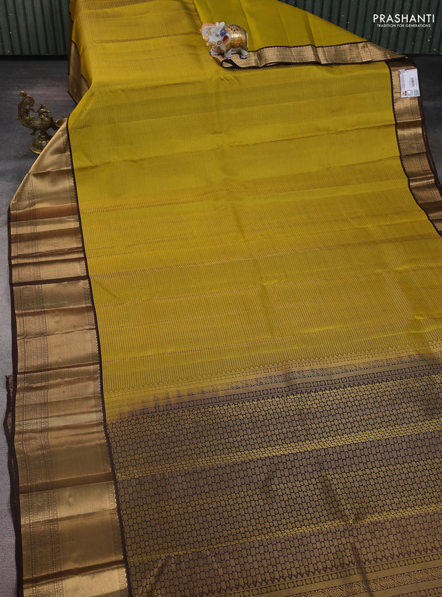 Pure kanchipuram silk saree mehendi green and coffee brown with allover small zari checked pattern and long zari woven border