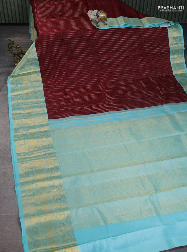 Pure kanchipuram silk saree maroon and light blue with allover zari weaves and long zari woven korvai border