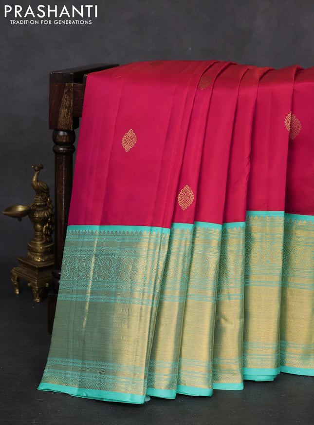 Pure kanchipuram silk saree dual shade of pinkish orange and teal shade with zari woven buttas and long zari woven korvai border