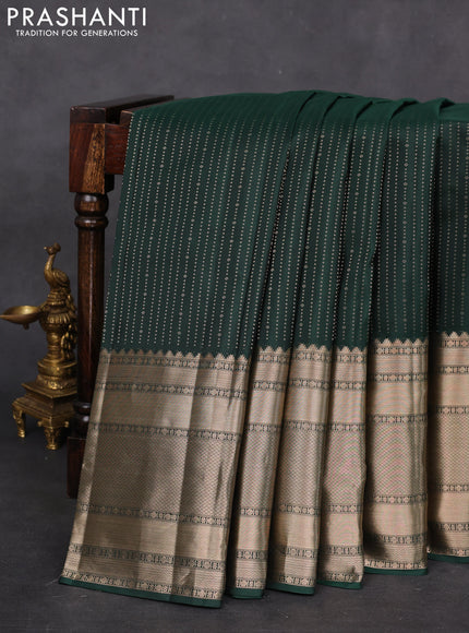 Pure kanchipuram silk saree bottle green and peach pink with allover zari weaves and long zari woven border