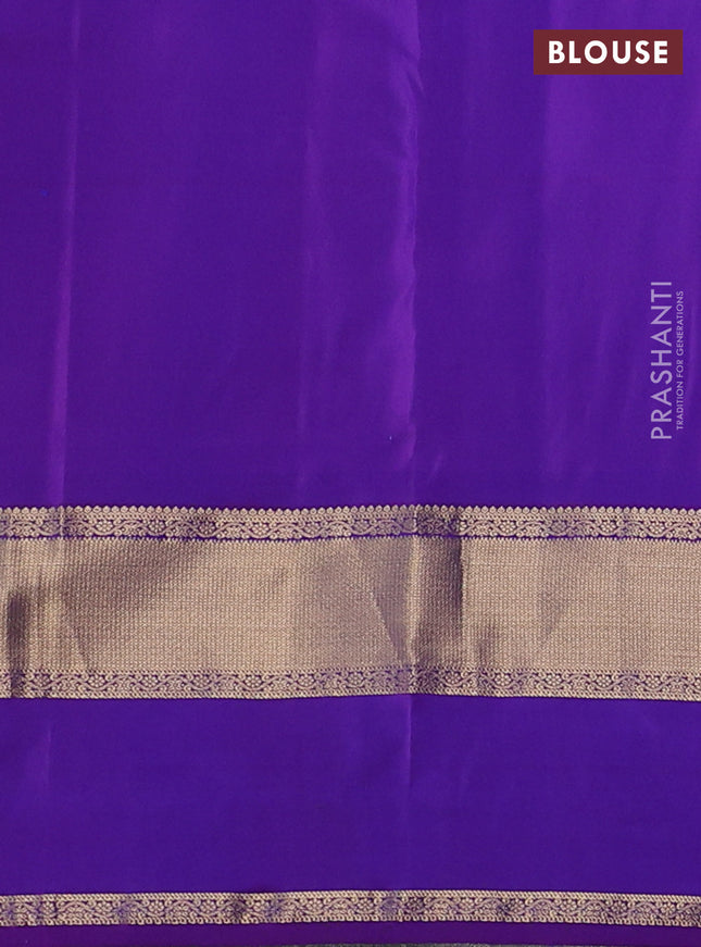 Pure kanchipuram silk saree dual shade of bluish green and purple with zari woven buttas and long rettapet zari woven border