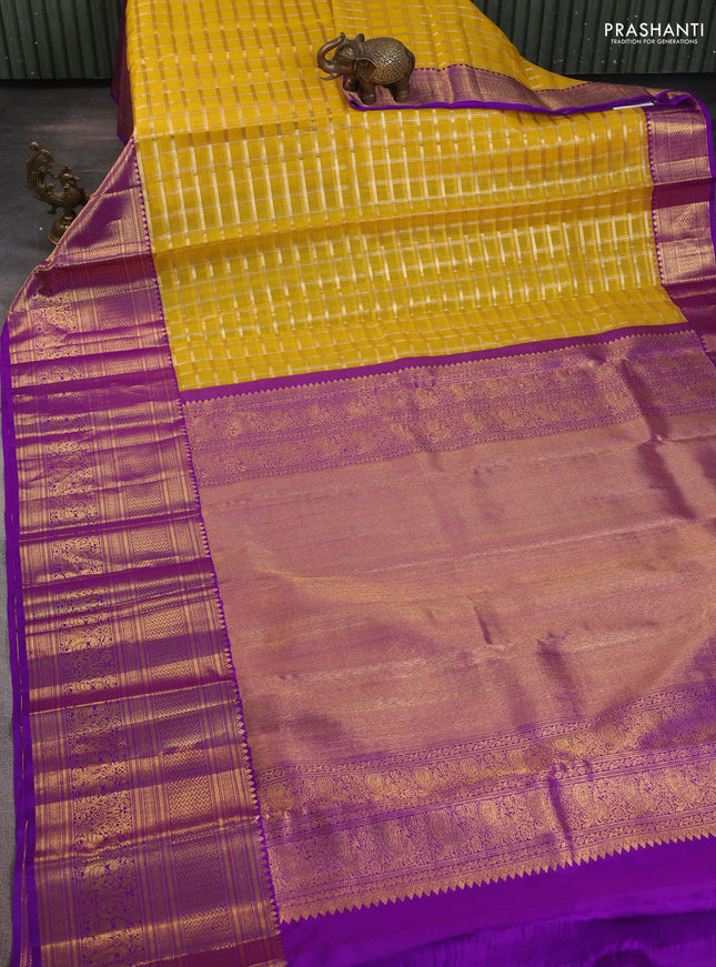 Kora kanchipuram silk saree mustard yellow and purple with silver & gold zari woven buttas and long zari woven border