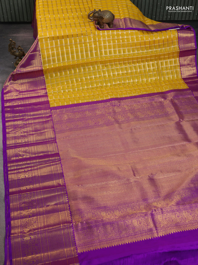 Kora kanchipuram silk saree mustard yellow and purple with silver & gold zari woven buttas and long zari woven border