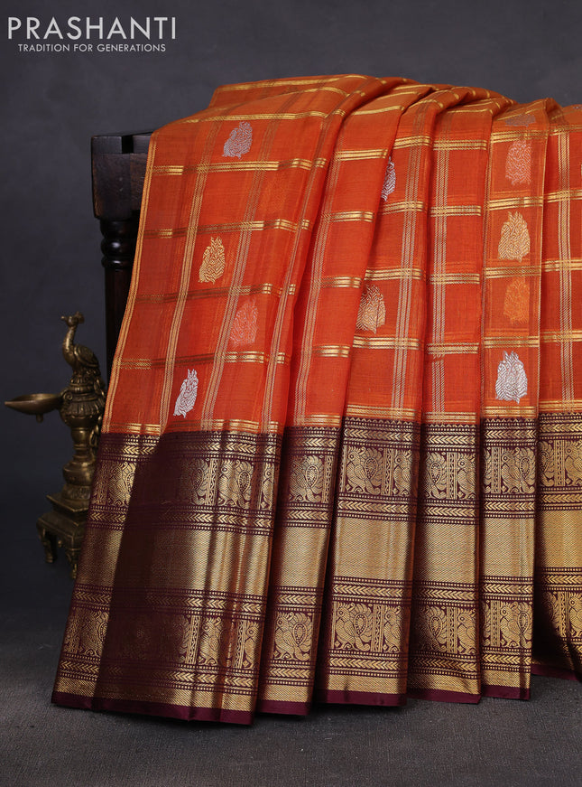 Kora kanchipuram silk saree orange and coffee brown with allover zari checks & buttas and long zari woven border