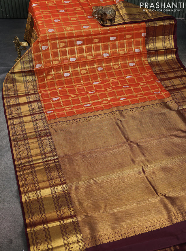 Kora kanchipuram silk saree orange and coffee brown with allover zari checks & buttas and long zari woven border