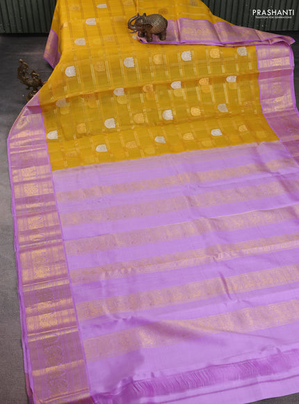 Kora kanchipuram silk saree mustard yellow and lavender with allover zari checks & buttas and zari woven border