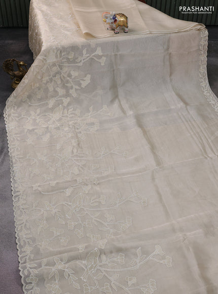 Pure tissue silk saree beige with applique work and scallop border